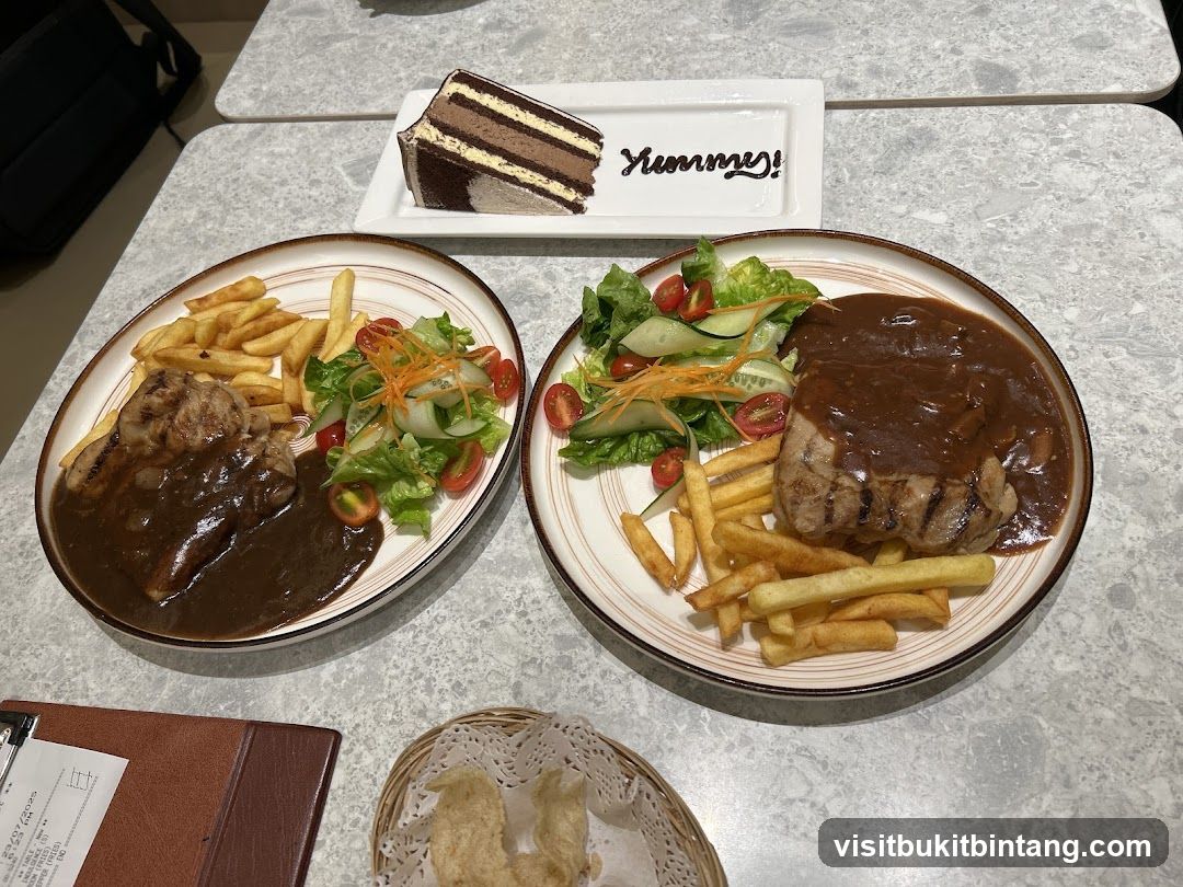 Two plates of steak with fries and salad, and a slice of chocolate cake