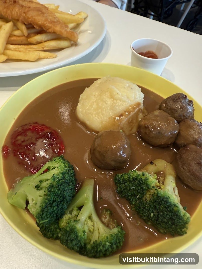 Meatballs with mashed potatoes and broccoli