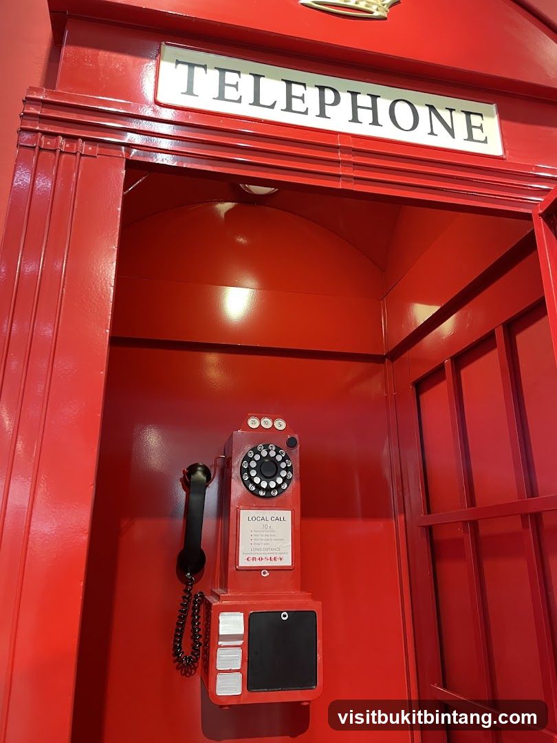 Red Telephone Booth with Vintage Phone