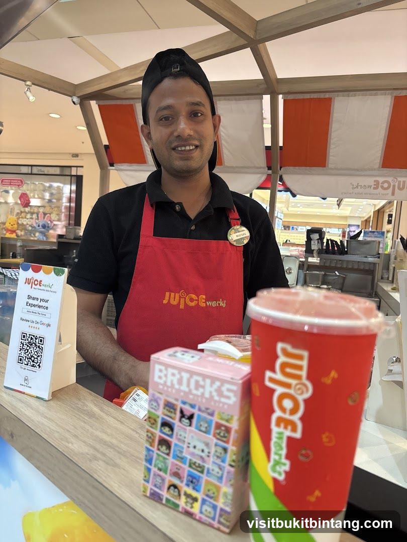 Juice Works Employee with Products