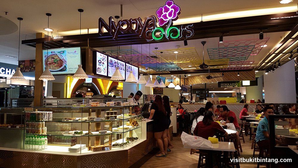 Food court with seating and food stalls