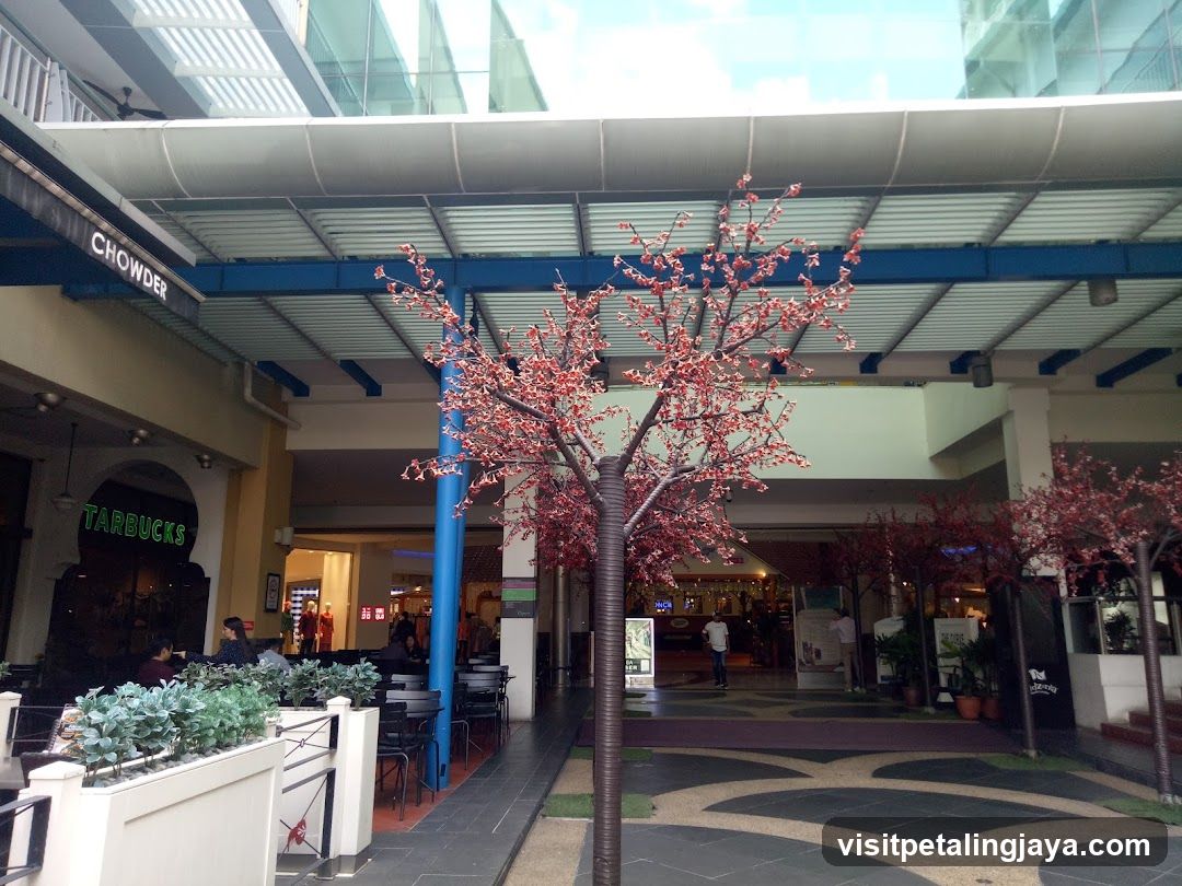 Shopping Mall Interior with Artificial Trees