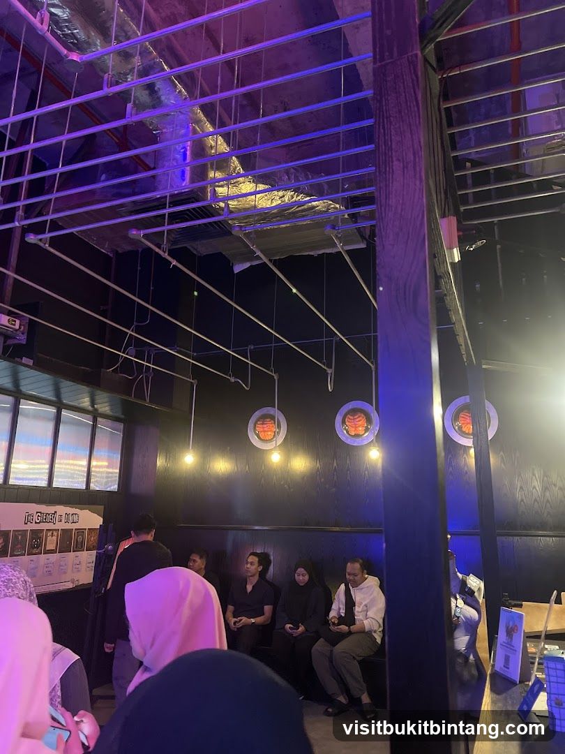 People waiting in a dimly lit room with unique decor