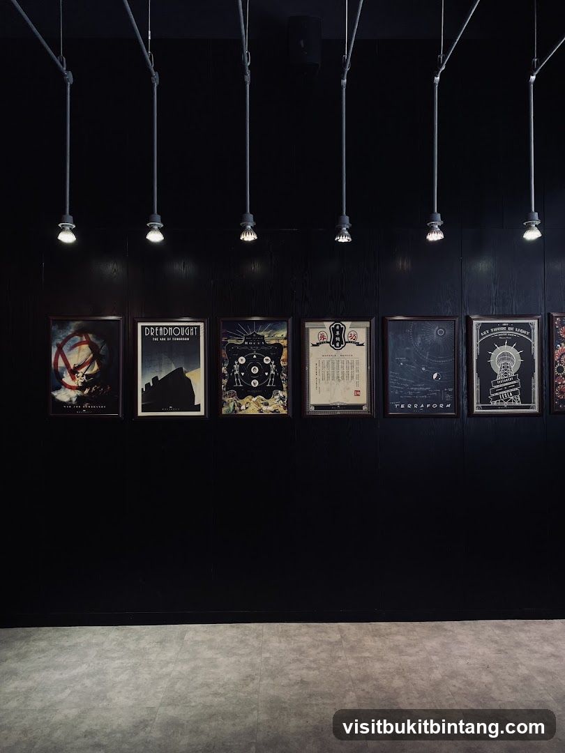 Framed posters on a black wall