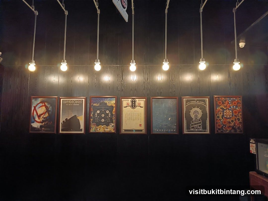 Framed posters on a dark wall