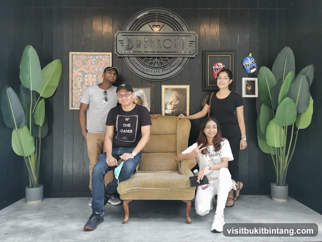 Group Posing in Front of Breakout Sign