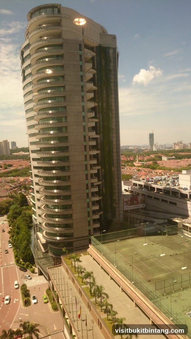 Modern Building with Balconies and Tennis Courts