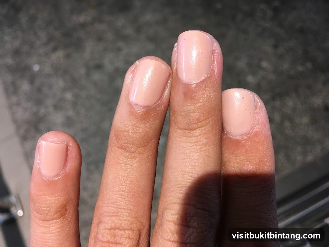Fingers with Light Pink Nail Polish