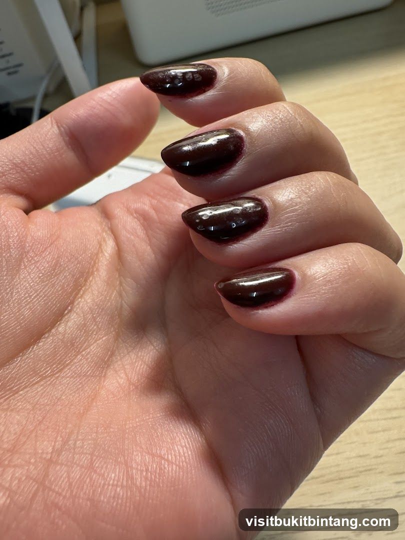 Dark Red Nails with Glitter Accents