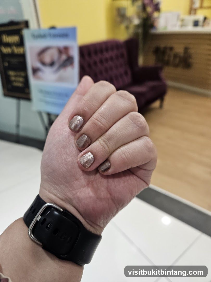 Manicured Hand with Glitter Polish