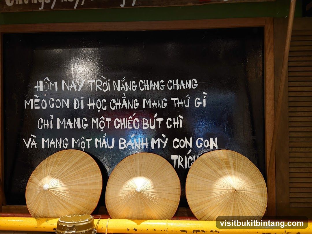 Chalkboard with Vietnamese Poem and Conical Hats