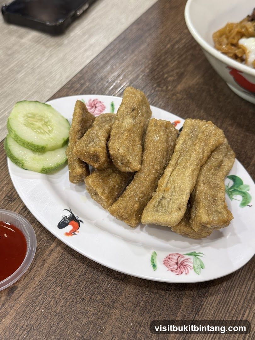 Fried Fish Cakes with Cucumber and Sauce
