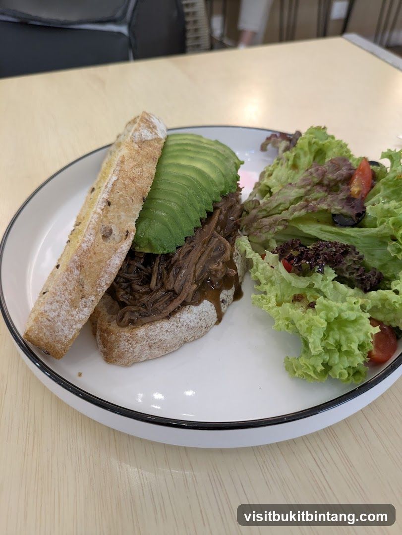 Pulled Meat Sandwich with Avocado and Salad