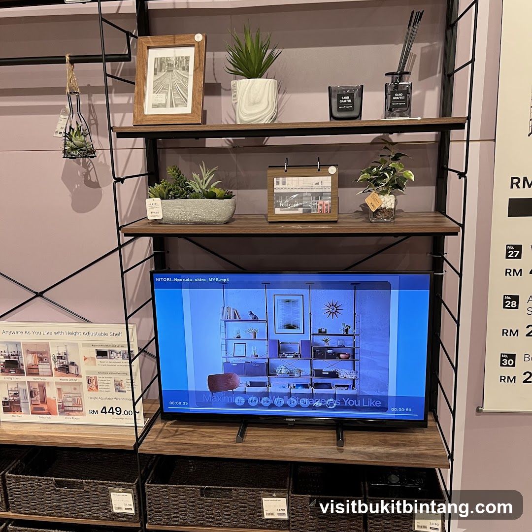 Display Shelving Unit with Decorative Items and Television