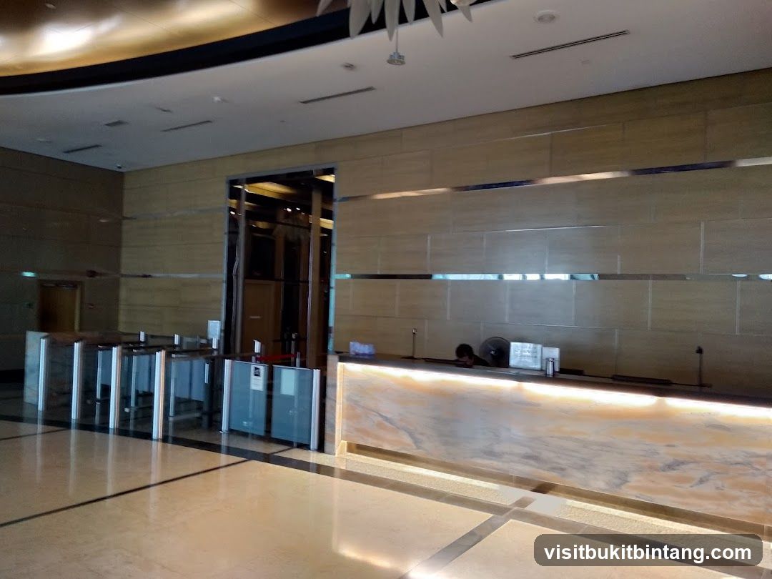 Lobby Entrance with Security Gates and Reception Desk