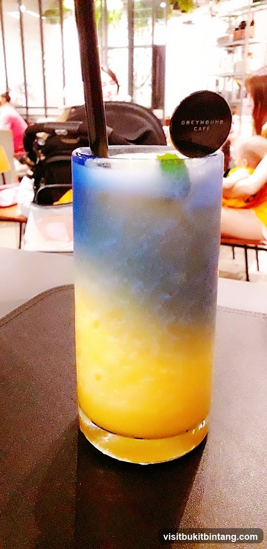 Layered Drink with Greyhound Cafe Logo