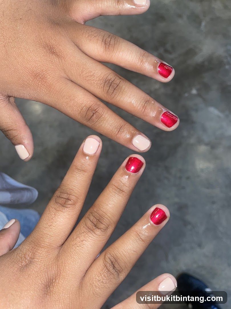 Two hands with manicured nails