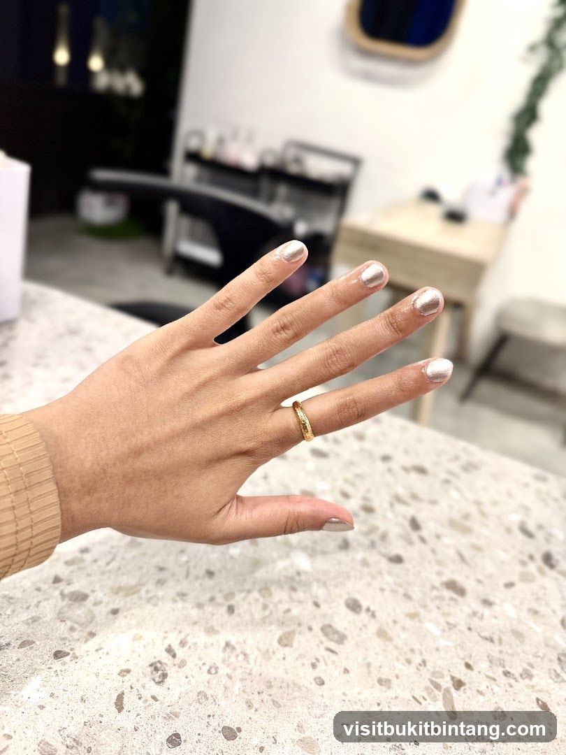 Woman's hand with metallic nail polish