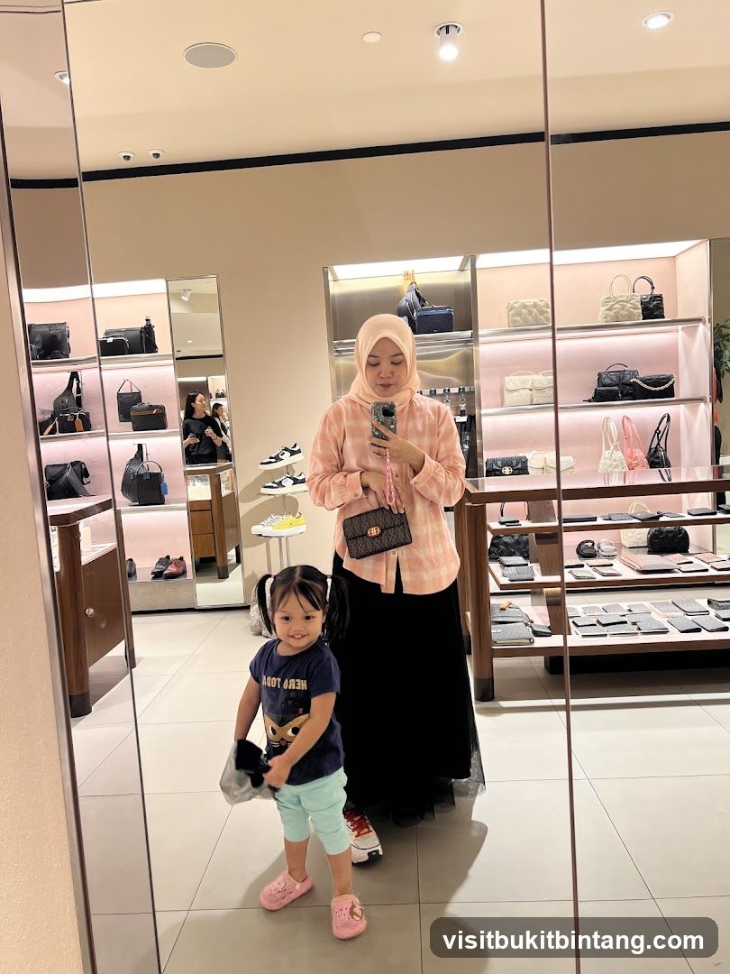 Woman and child taking a mirror selfie in a store