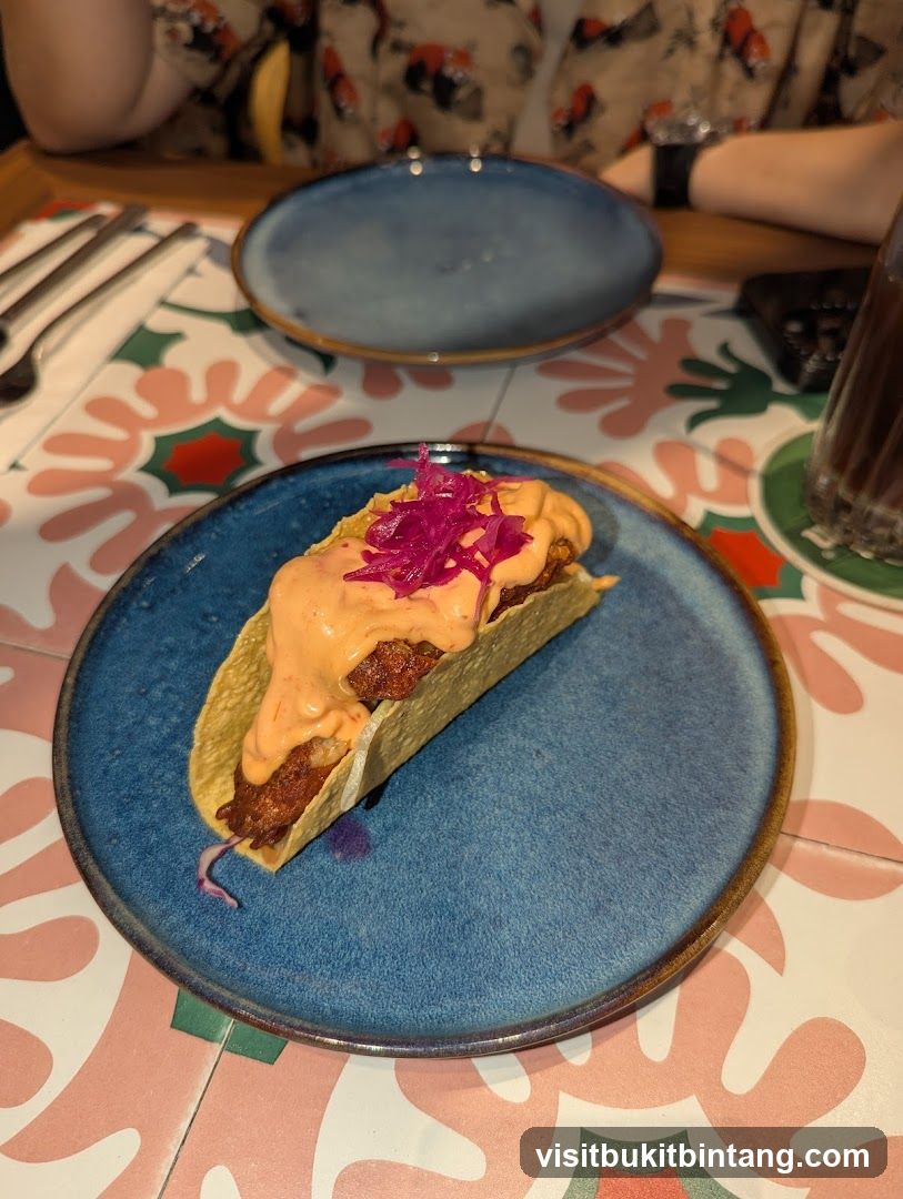 Taco with Sauce and Pickled Onions