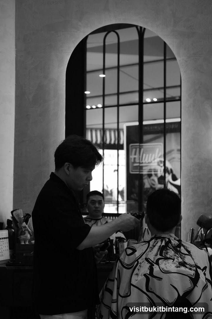 Barber cutting hair