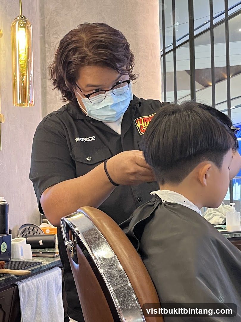 Barber cutting a child's hair
