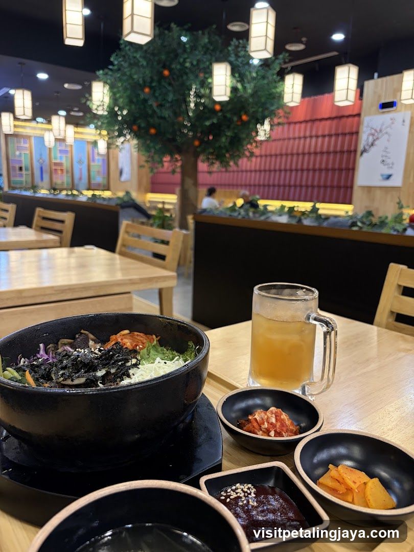 Korean Restaurant Interior with Banchan and Drink