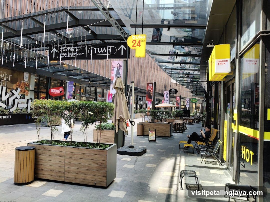 Outdoor Shopping Area with Storefronts and Signage