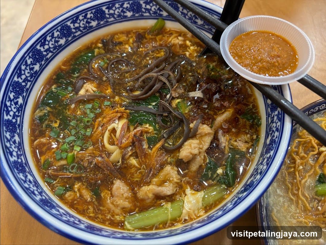 Bowl of Noodle Soup with Side Dipping Sauce