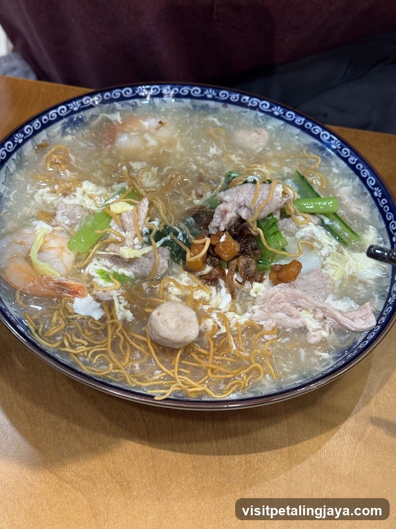 Bowl of Noodle Soup with Shrimp and Meatballs