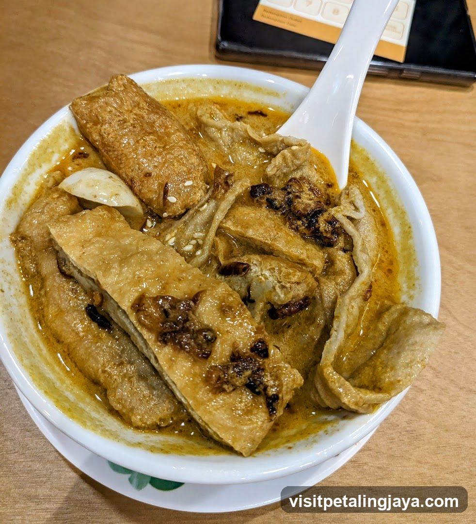 Bowl of Curry Fish Balls and Tofu Puffs