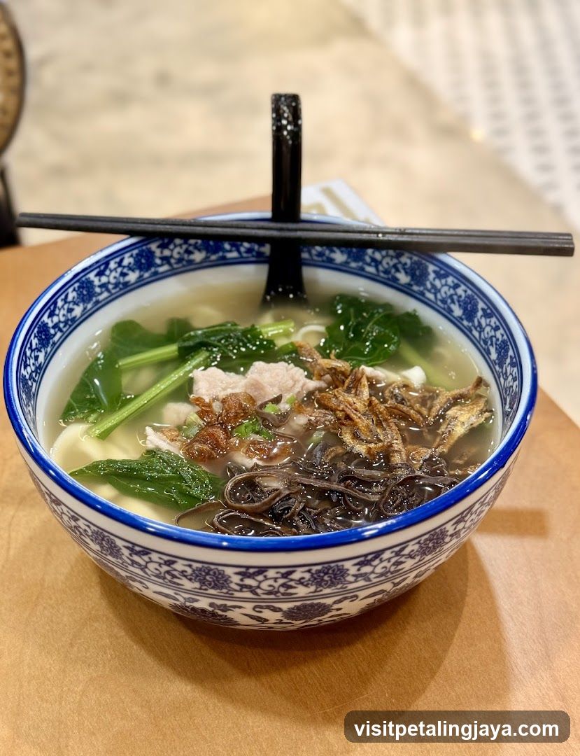 Bowl of Noodle Soup with Vegetables and Meat