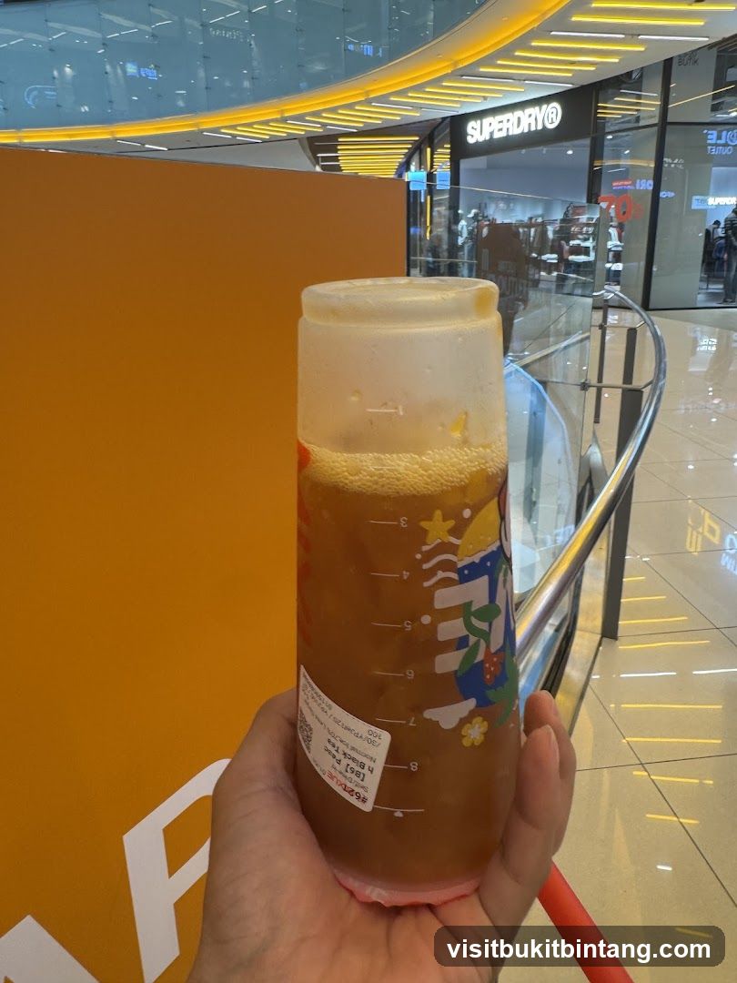 Beverage in a cup with store in background