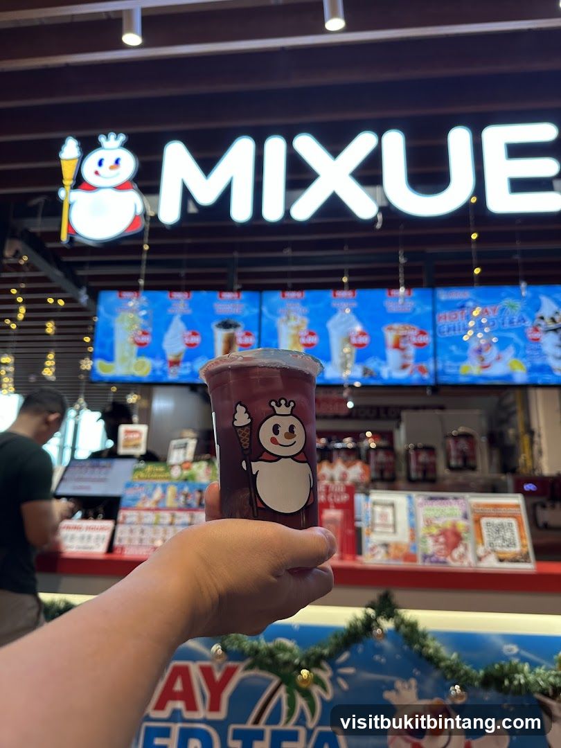 Mixue Drink with Storefront in Background