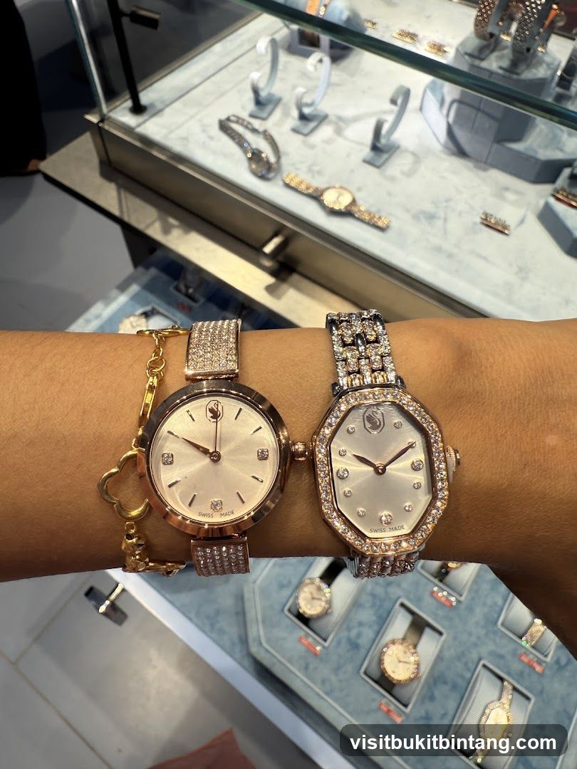 Two jeweled watches on a wrist