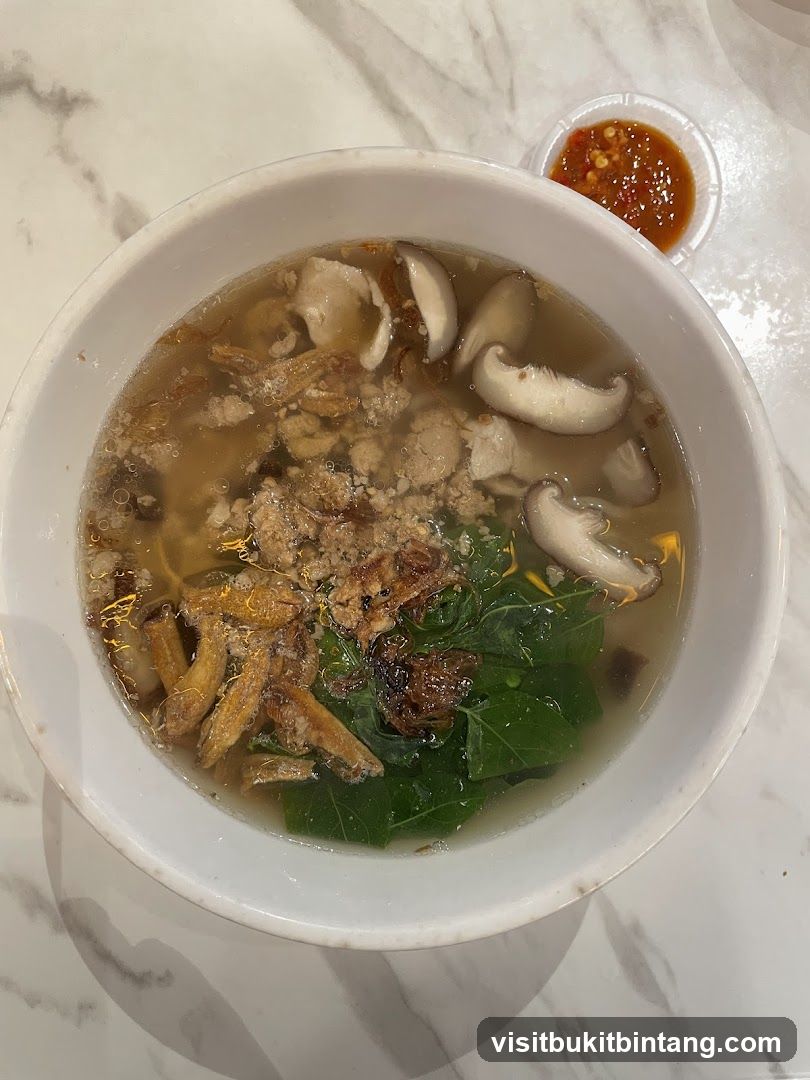 Bowl of Soup with Mushrooms and Greens