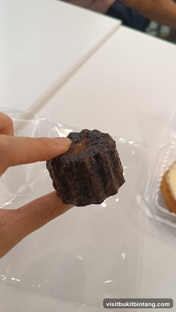 Close-up of a canelé pastry