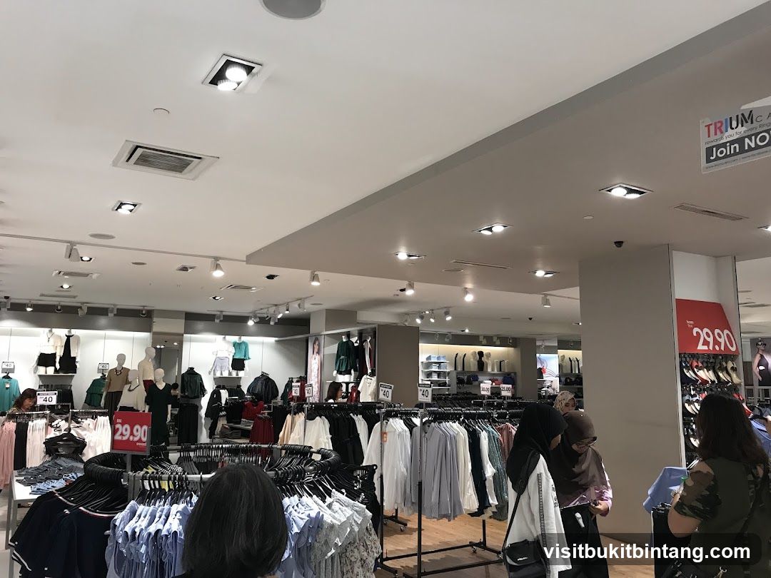 Clothing store interior with mannequins and racks of clothes