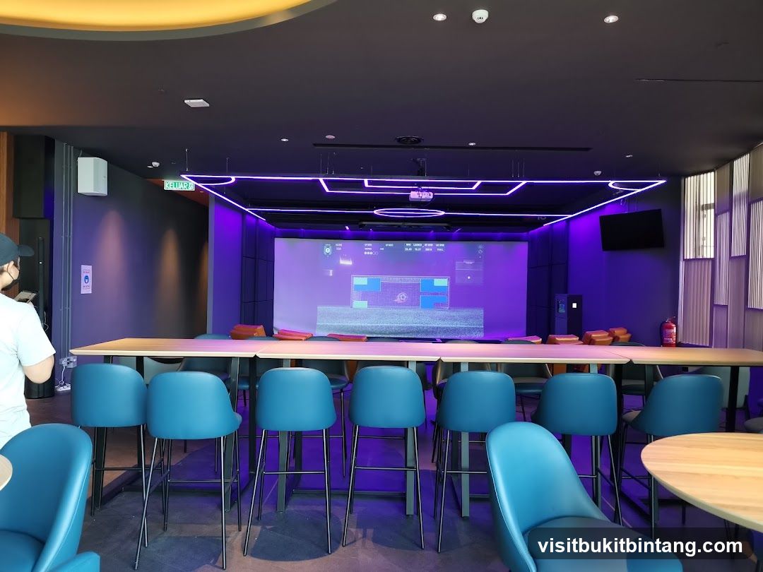 Indoor entertainment area with golf simulator