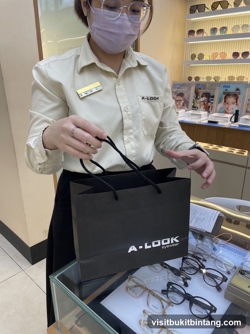 Optician holding a shopping bag