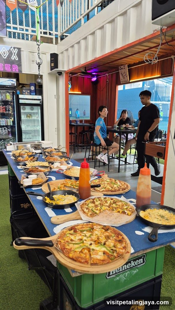 Food Display Table with Pizzas and Sides