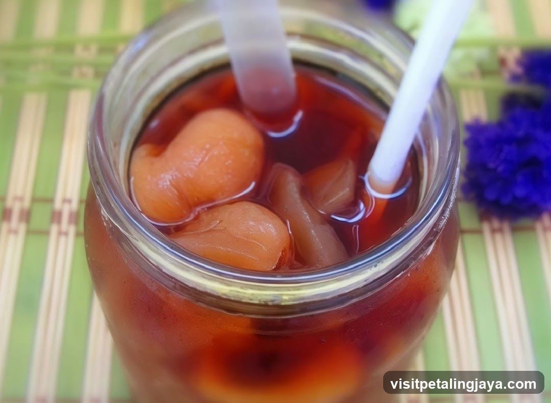 Jars of preserved fruit in syrup