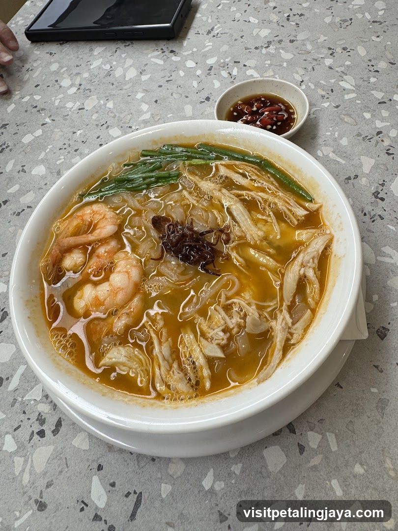 Bowl of Noodle Soup with Shrimp and Chicken