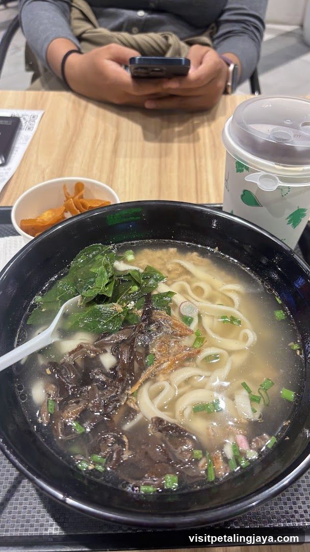 Bowl of Noodle Soup with Side Dish