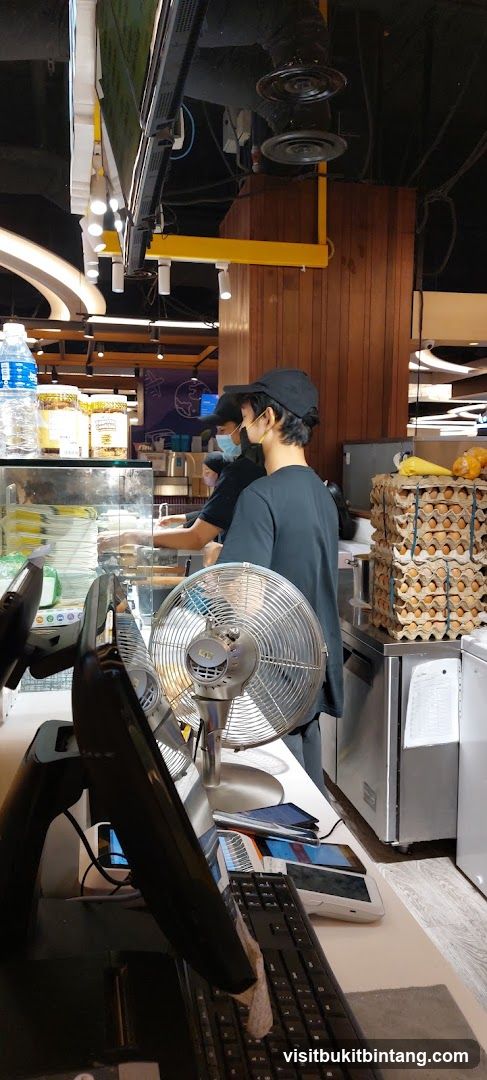 Staff preparing food behind a counter