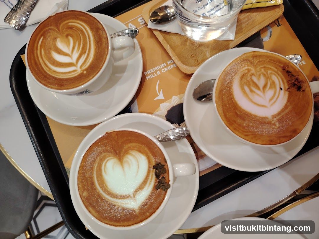Three coffees with latte art