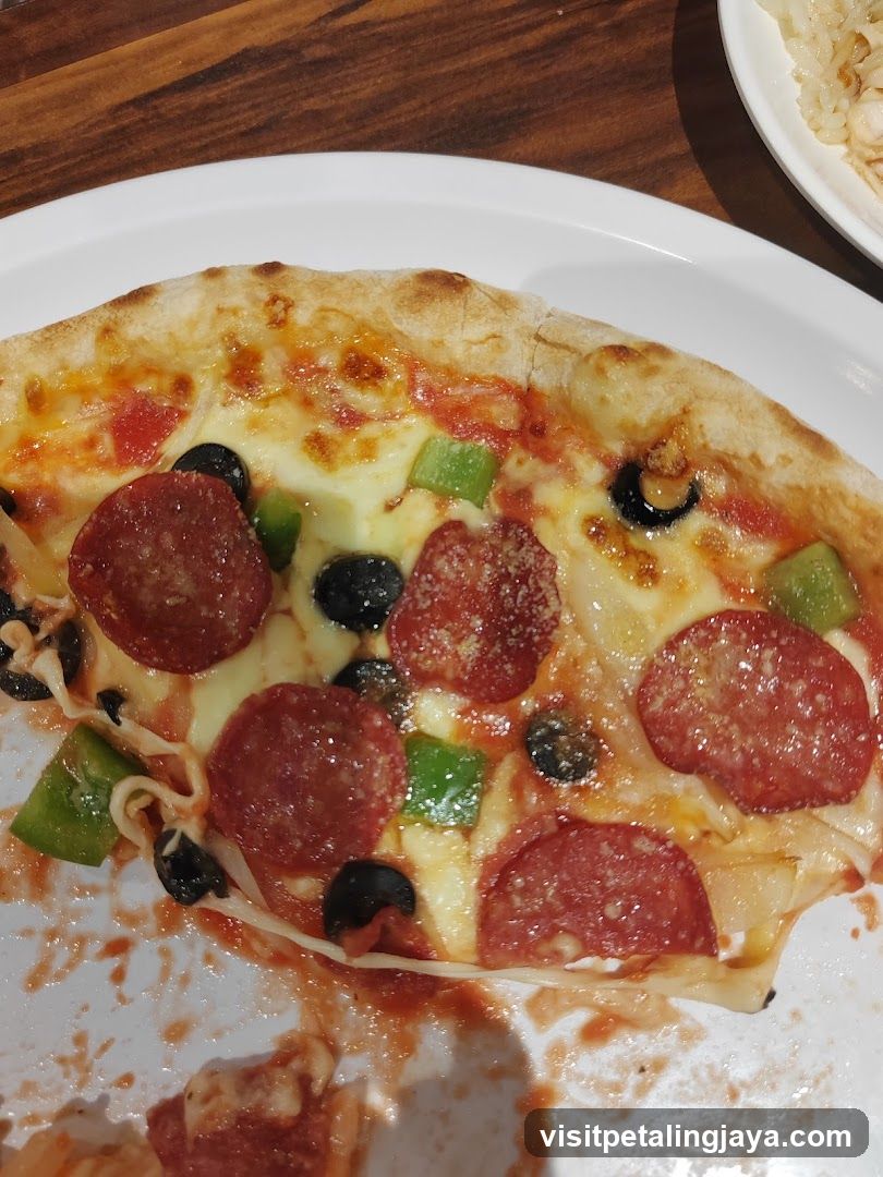 Pepperoni and Vegetable Pizza Slice