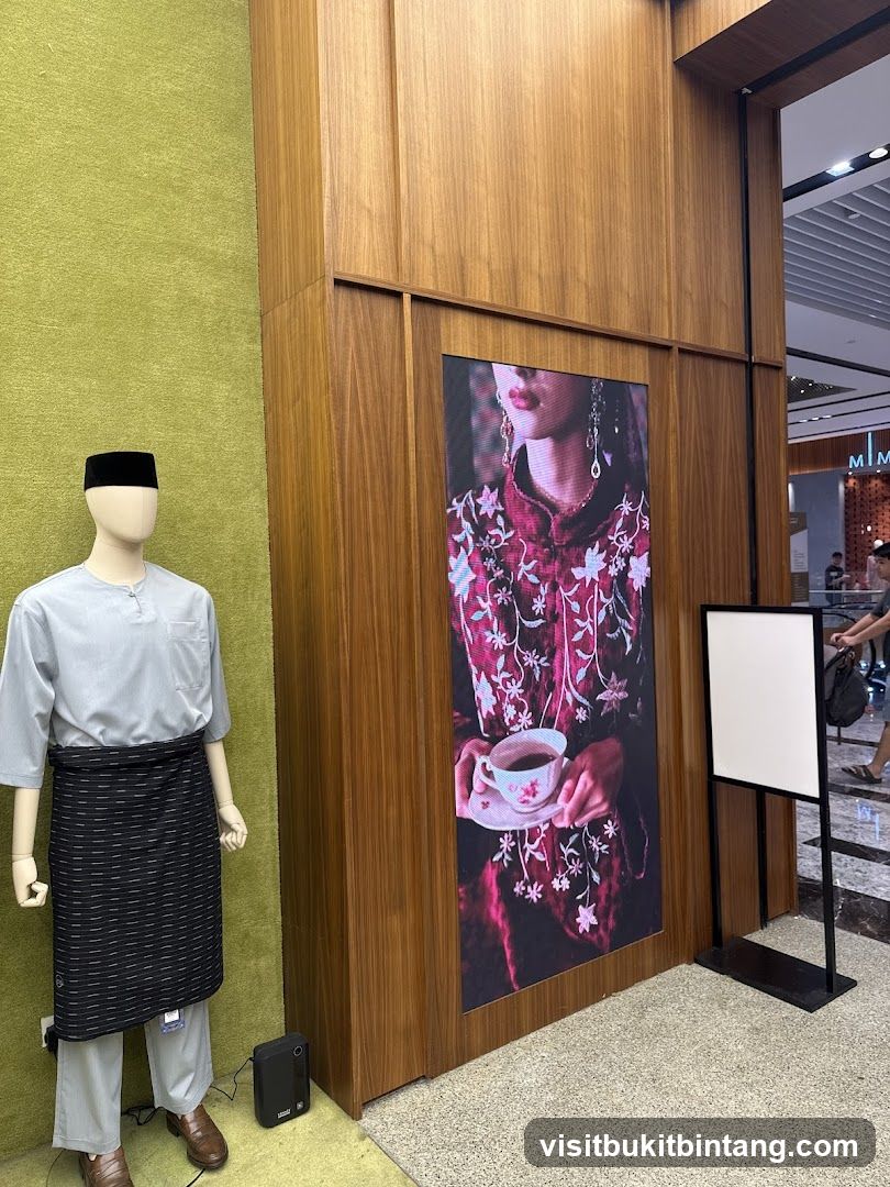 Mannequin in traditional attire and digital display