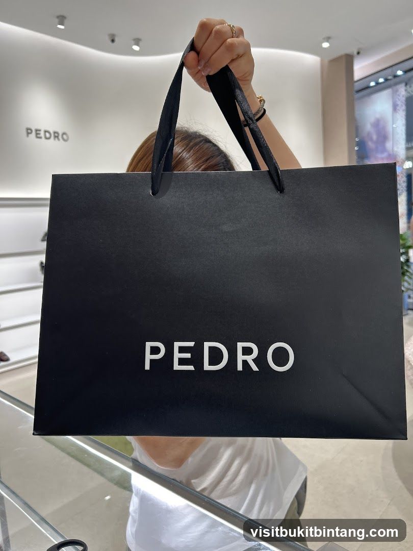Person holding a shopping bag