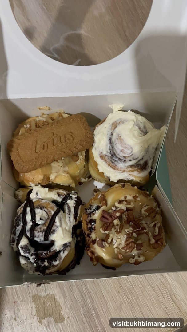 Four Cinnamon Rolls in a Box